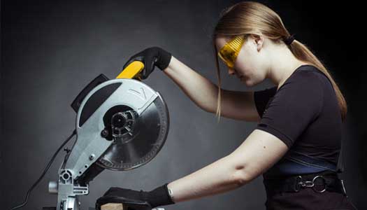 Woman using a saw
