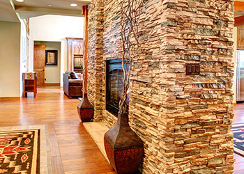 Interior stone veneer fireplace